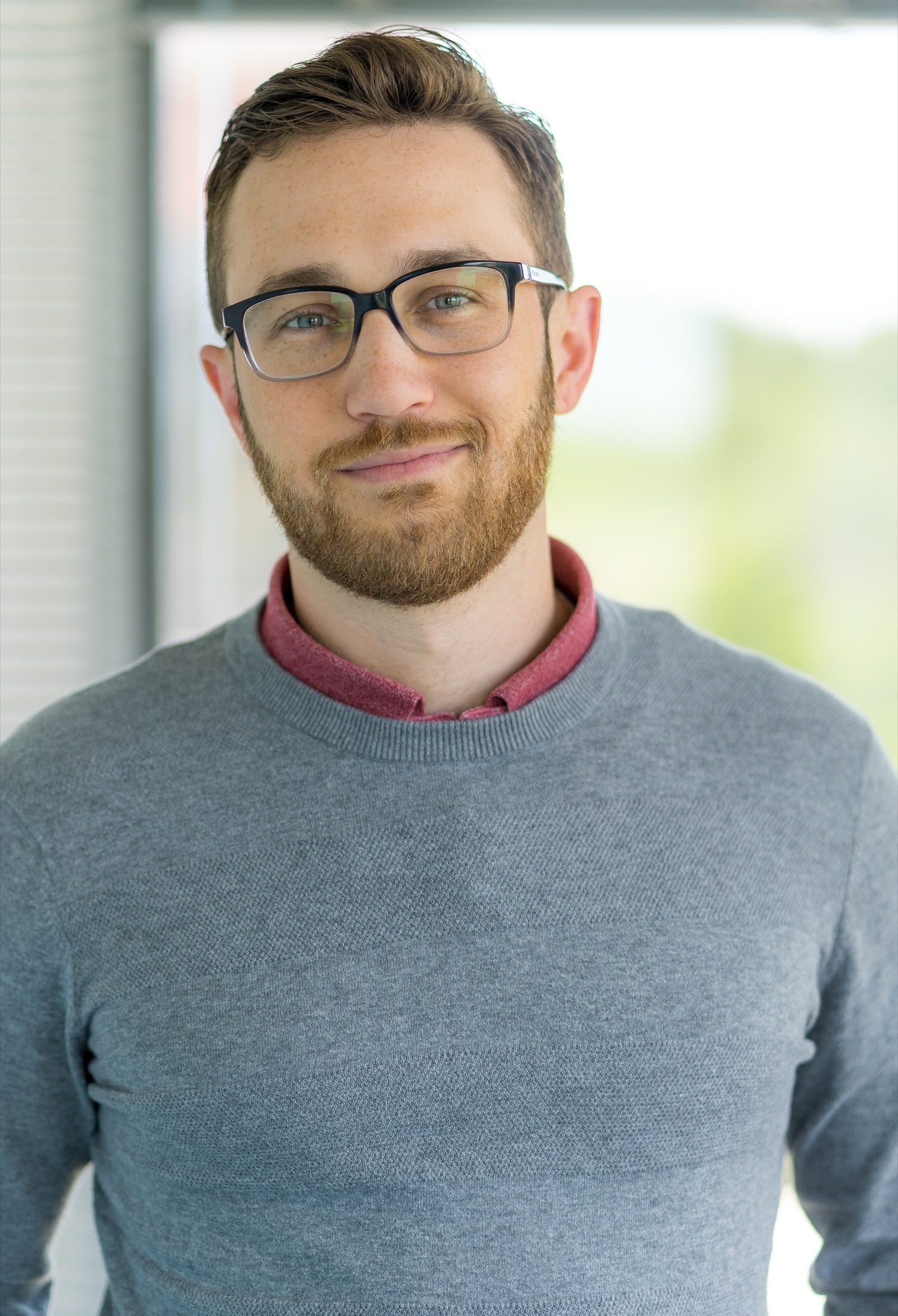 Professional wearing glasses photographed for an executive portrait
