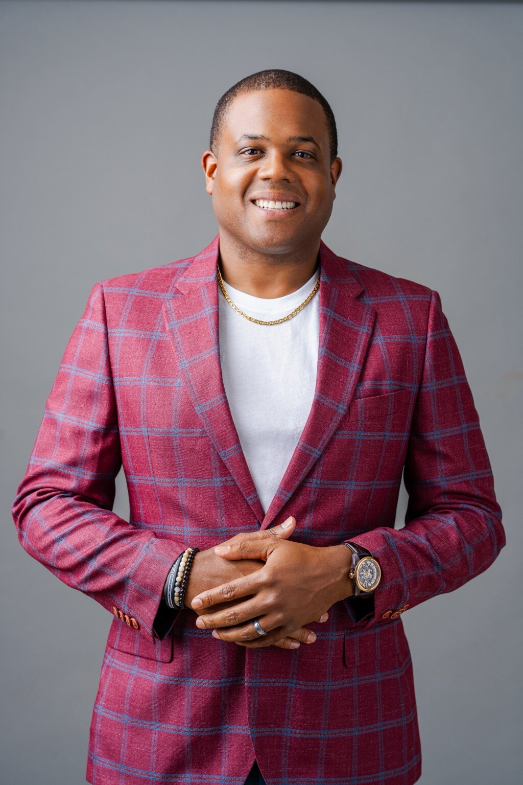 Sam Blackmon in a red plaid jacket, photographed for his author project by Motion Visual Media